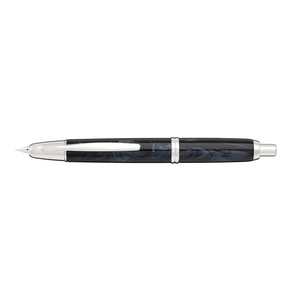 The Pilot Capless Marble Black Fountain Pen stunning and vibrant marble-colored black resin body extends sophistication to your writing style. Every single pen is one-of-a-kind because no two marbling patterns are the same. Designed to delight the fountain pen collector, the pen’s exceptional body is enhanced with lustrous rhodium accents. The Capless fountain pen by Pilot is the world’s first and favorite retractable fountain pen. The Vanishing Point was revolutionary when it was engineered in 1963 and con