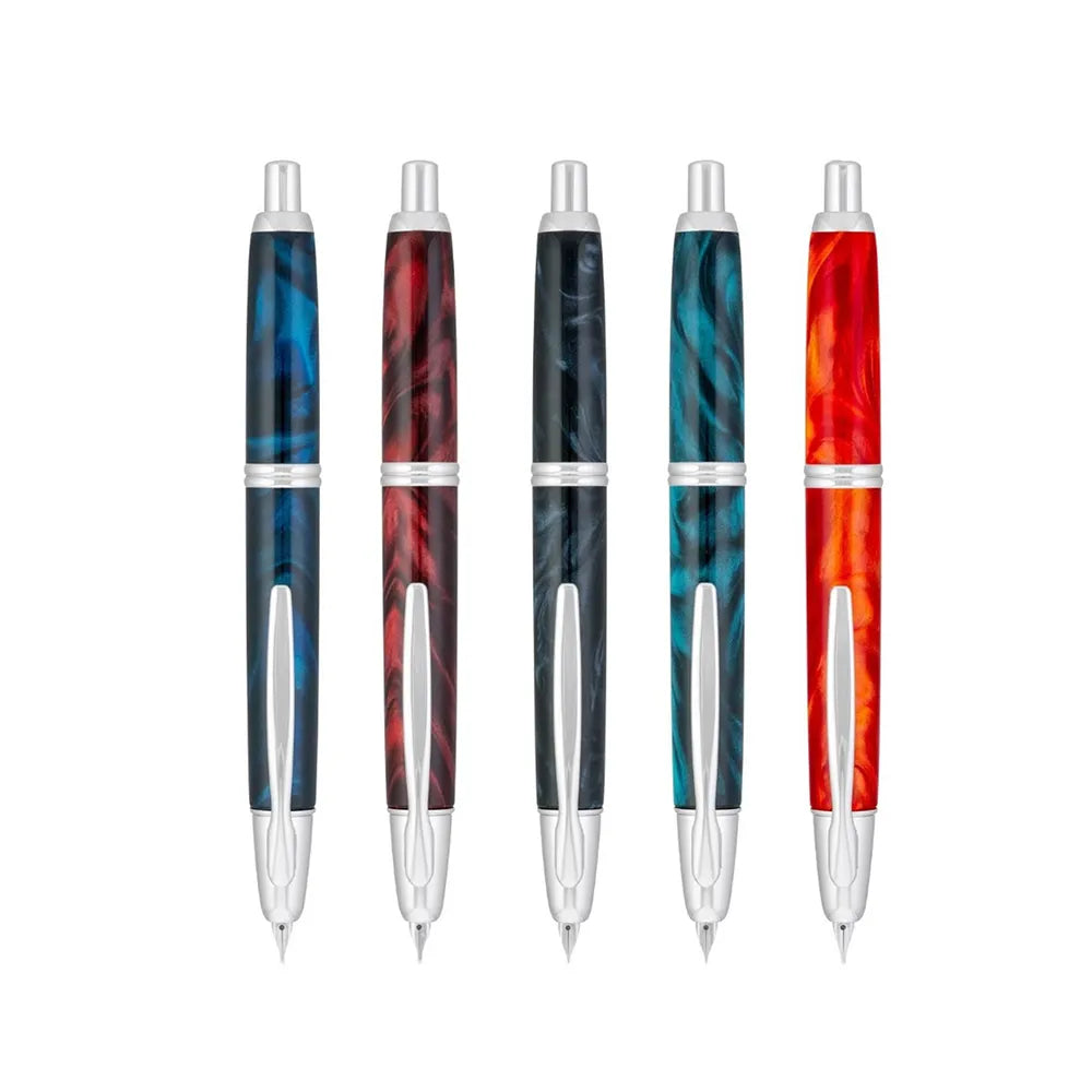 The Pilot Capless Marble Red Fountain Pen stunning and vibrant marble-colored Red resin body extends sophistication to your writing style. Every single pen is one-of-a-kind because no two marbling patterns are the same. Designed to delight the fountain pen collector, the pen’s exceptional body is enhanced with lustrous rhodium accents. The Capless fountain pen by Pilot is the world’s first and favorite retractable fountain pen. The Vanishing Point was revolutionary when it was engineered in 1963 and continu