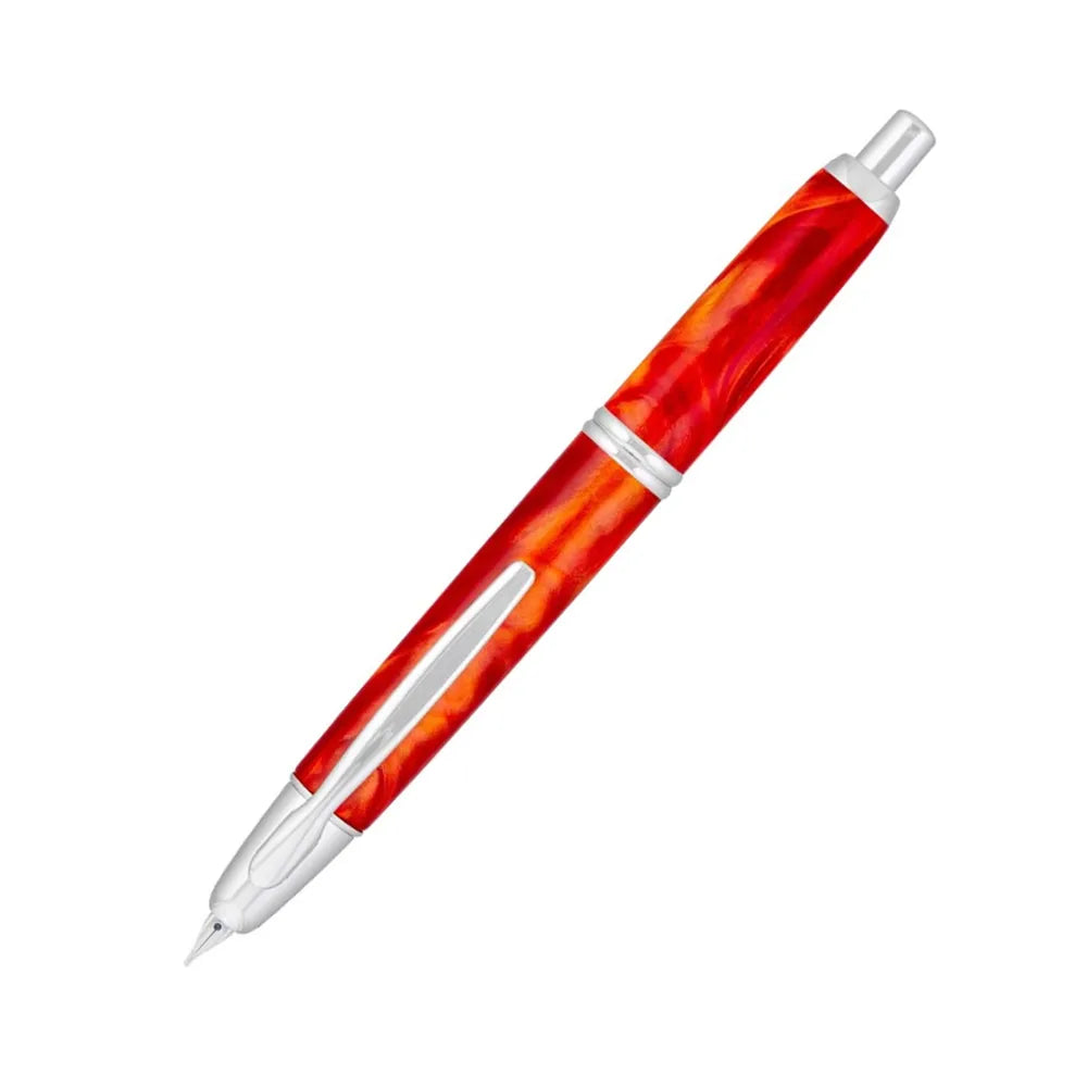 The Pilot Capless Marble Orange Fountain Pen stunning and vibrant marble-colored Orange resin body extends sophistication to your writing style. Every single pen is one-of-a-kind because no two marbling patterns are the same. Designed to delight the fountain pen collector, the pen’s exceptional body is enhanced with lustrous rhodium accents. The Capless fountain pen by Pilot is the world’s first and favorite retractable fountain pen. The Vanishing Point was revolutionary when it was engineered in 1963 and c