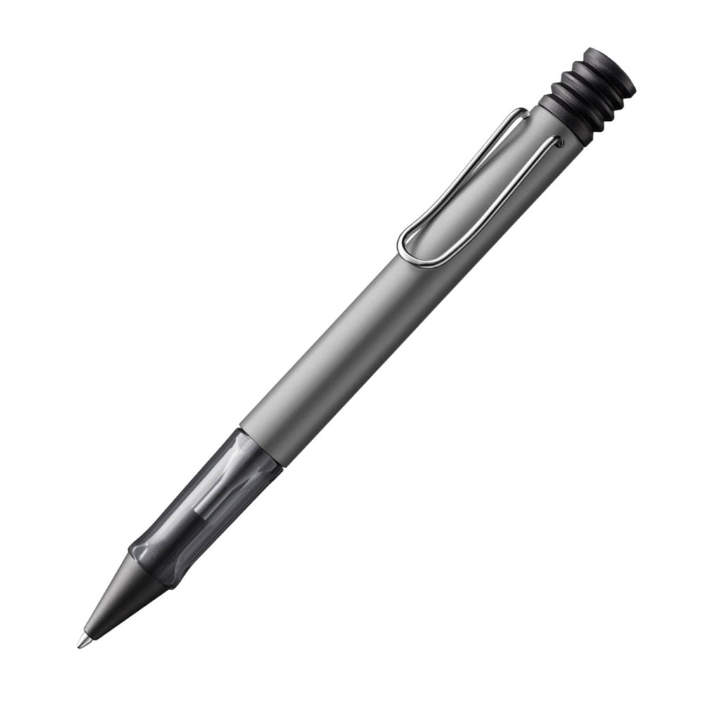 The Lamy AL-Star Ballpoint Pen is the attractive, young writing instrument which satisfies even the highest requirements. Made of feather-light robust aluminium, anodised in various colours. With ergonomic transparent grip and spring-action metal clip. Ballpoint pen comes with LAMY large capacity refill M 16 black. Aluminium, graphite anodized / metal clip / ergonomic plastic grip / with giant refill LAMY M16 M black Part No. 4000914