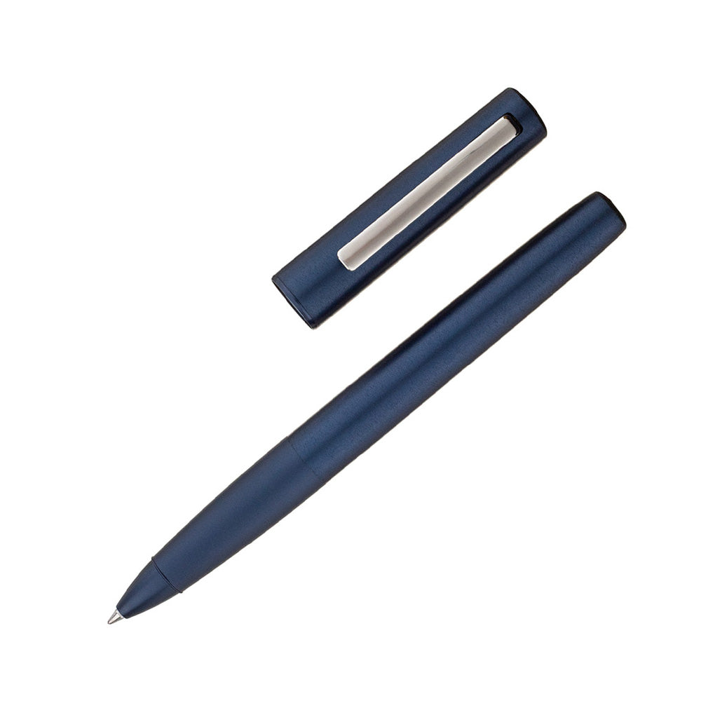 LAMY aion deepdark blue Rollerball pen The smooth deep-drawn aluminium body components are the first of their kind and give the series a unique, harmonious appearance. Brushed and blasted surfaces are refined with a brilliant silk-matt anodic coating finish, creating formal tension. The sturdy high gloss polished clip perfectly rounds off the overall design. brushed aluminum and satin matt dark blue anodized / with LAMY M63 M black rollerball pen refill