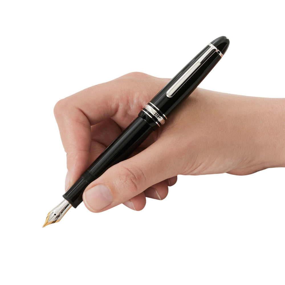 The Meisterstück LeGrand in deep black precious resin with platinum-coated details, surmounted by the white star emblem and finished with a handcrafted gold nib, evolves into a distinctive design icon. Perfect travel companion with convenient cartridge filling system. Colour : Black Black precious resin inlaid with Montblanc emblem Platinum-coated clip with individual serial number Cap inlaid with the Montblanc emblem Handcrafted Au 585 / 14Kt gold nib with rhodium-coated inlay Made in Germany