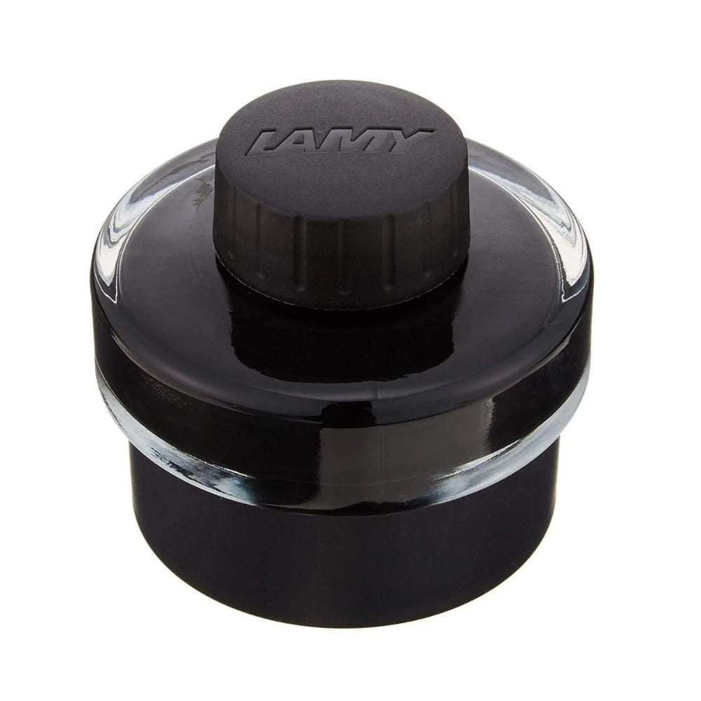 LAMY T52 bottled ink, 50ml, comes with an in-built roll of blotting paper around the base and ink residue collecting basin for effortless and mess-free refilling of your fountain pen. Available in a variety of colours and specifically engineered to suit LAMY fountain pens. Body Material : Glass/Plastic Cap Material : Plastic Ink Capacity : 50 ml Ink Colour : Black Product Type : Writing Instruments Collection : T52 Brand Origin: Germany