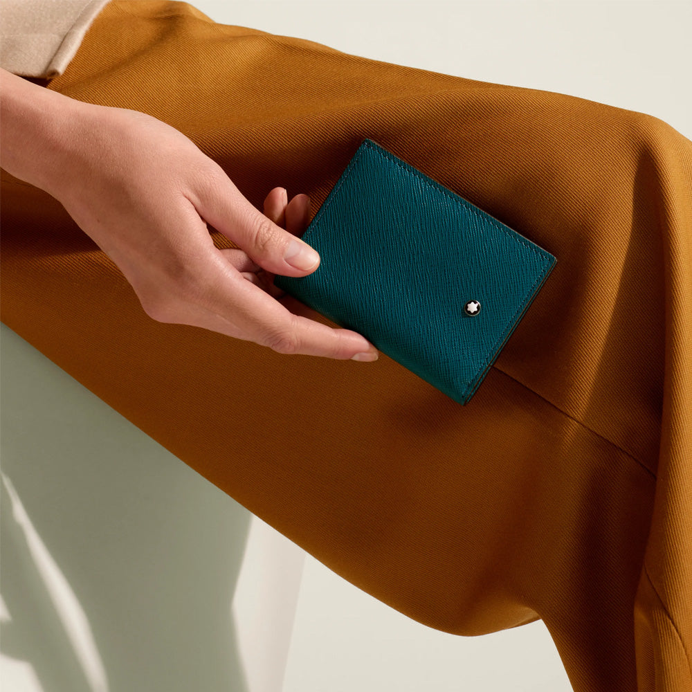 Despite its compact design, this mini wallet crafted from Cyprus blue leather is remarkably functional. Internally, it houses four credit card slots, a business card compartment, and an additional pocket. On the exterior, there’s a slot for an additional credit card. Material : Calf-skin leather Leather : Saffiano printed full-grain bovine leather Color : Cyprus Blue Lining : Fabric Dimensions : 80X10X105 mm Country of Origin : Italy