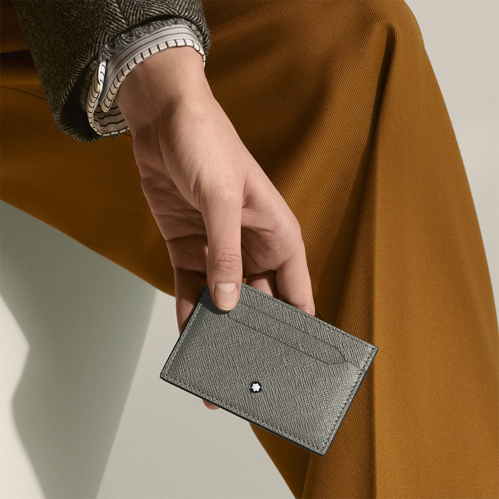 Made from luxurious Saffiano-printed leather in medium grey, this card holder adds a stylish dimension to everyday life. With space for up to five credit cards, it ensures you keep your core essentials with you on the go. The Montblanc emblem details the front side. Material : Leather Leather : Saffiano-printed ink grey leather Color : Medium Grey Lining : Fabric Dimensions : 110 X 5 X 75 mm Country of Origin : Italy