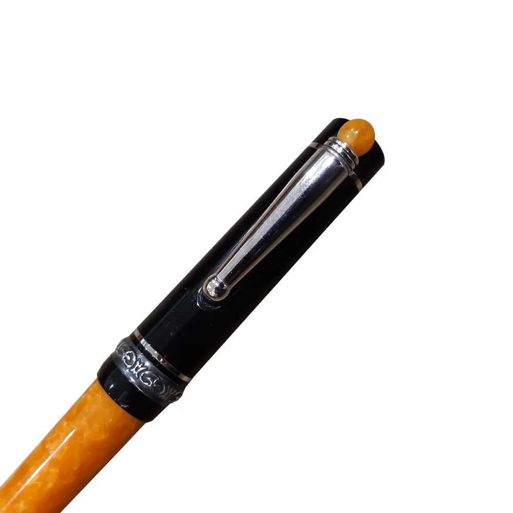 The Delta Lucky We Mechanical Pencil is designed with a “We” integrated into the cap of the pen for luck. The cap and barrel are hand turned in black and orange resins. Unforgettable Ballpoint pen from the handmade collection. Black/Orange Resign with 925% Sterling Silver Trim Twist-action ballpoint pen Filling System : 0.7mm Lead hand-made, hand-turned Terracotta Orange and Solid Black resin Made In Italy