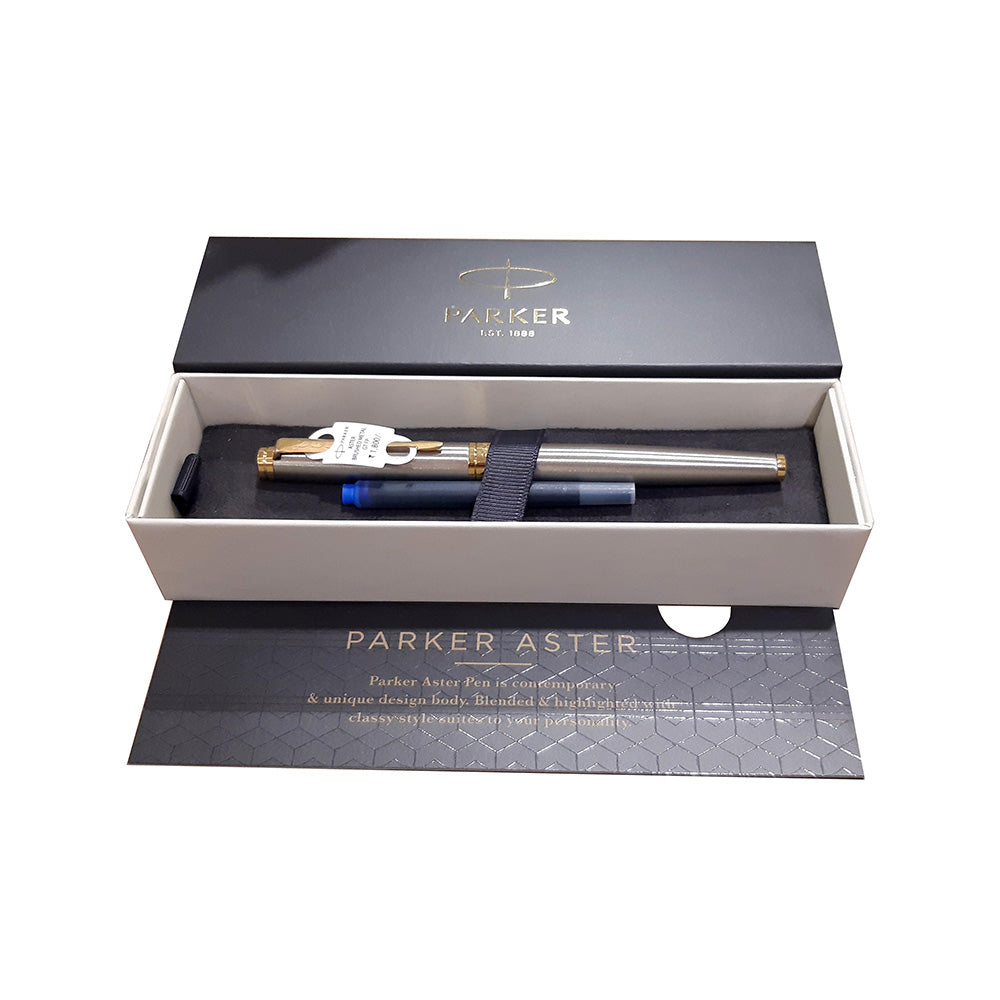 Parker Aster Fountain Pen With Brushed Metal Finish Brushed Metal Barrel And Gold Plated Trim. A Contemporary & Unique Design Blended Highlighted With A Gold Plated Ring On The Barrel. Body Colour : Brushed Metal Gold Plated trim for premium look Pen opening mechanism: Cap off/ cap on Stainless Steel Medium Nib A contemporary and unique design blended highlighted with a gold plated ring on the barrel Country of Origin: India