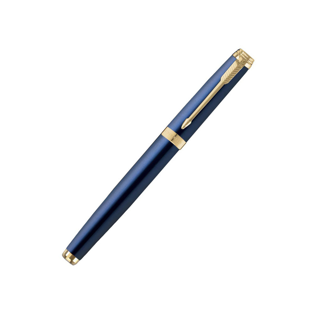 Parker Ambient Blue Gold Trim Rollerball Pen All-Over Blue Lacquered Cap And Barrel With Brushed Metal Grip, Highlighted By Gold Plated Trim. Cap On/Cap Off Supplied With Standard/Ultra Fine Navigator Roller Ball Refill. Finish: Blue Lacquered Trim : Gold Plated Trim Body Material: Powder Coating Stainless Steel Closure : Cap On/off Ink Colour : Blue Nib Features: Ultra Fine Navigator Attractive Packing for Gift.