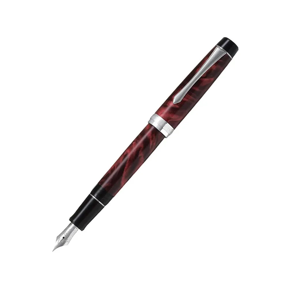 The Pilot Custom Heritage SE Marble Red CT Fountain Pen is a stunning and vibrant marble-colored resin body extends sophistication to your writing style. Every single pen is one-of-a-kind, because no two marbling patterns are exactly the same. The Pilot Custom Heritage SE fountain pen is smooth writing with a finely crafted 14 karat gold, #5, rhodium plated nib, available in Fine or Medium. Designed to delight the fountain pen collector, the pen’s exceptional body is enhanced with lustrous rhodium accents. 