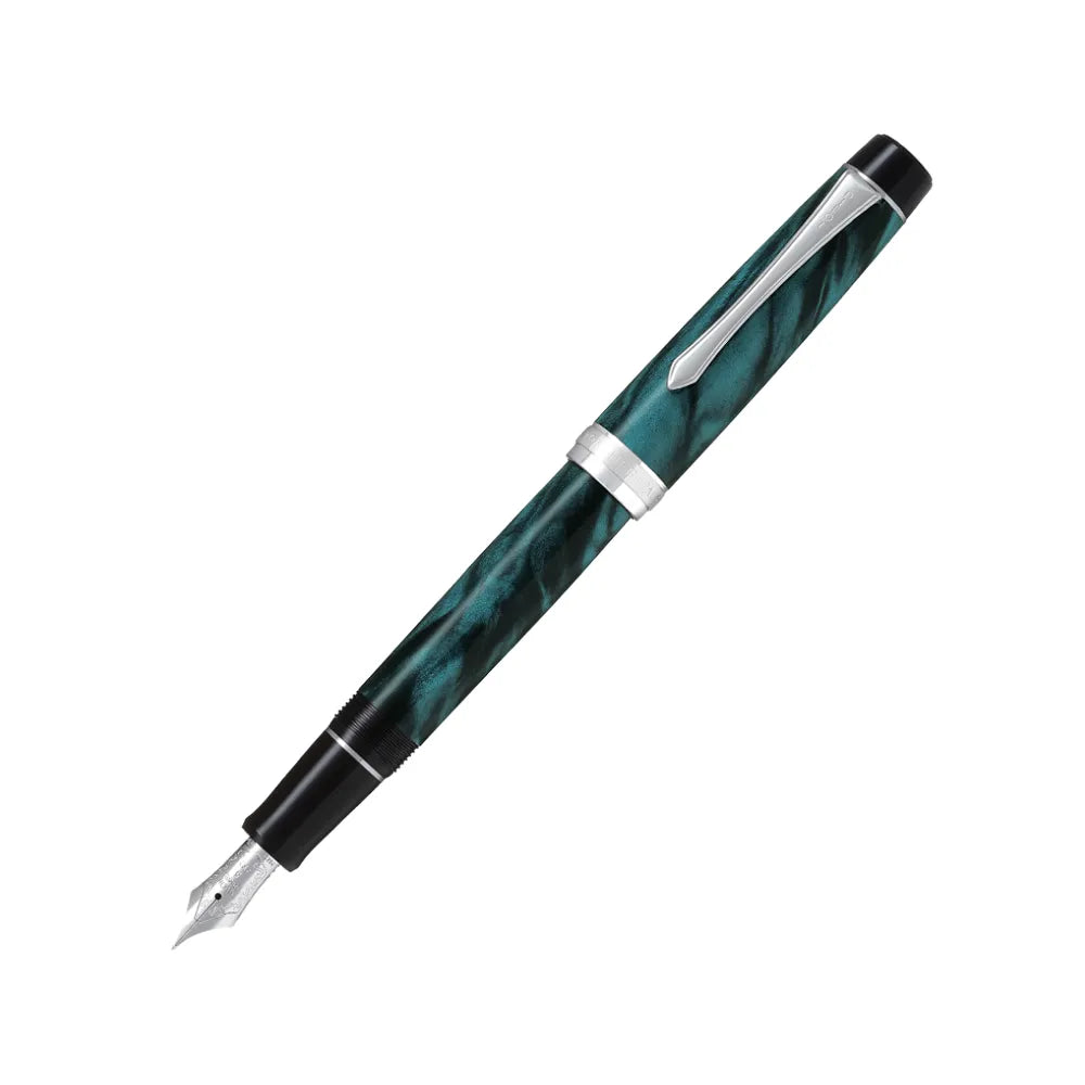 The Pilot Custom Heritage Marble SE Green Fountain Pen is a stunning and vibrant marble-colored resin body extends sophistication to your writing style. Every single pen is one-of-a-kind, because no two marbling patterns are exactly the same. The Pilot Custom Heritage SE fountain pen is smooth writing with a finely crafted 14 karat gold, #5, rhodium plated nib, available in Fine or Medium. Designed to delight the fountain pen collector, the pen’s exceptional body is enhanced with lustrous rhodium accents. T