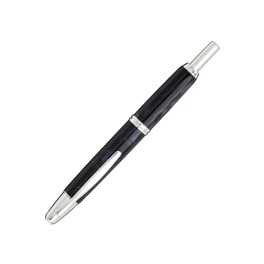 The Pilot Capless Marble Black Fountain Pen stunning and vibrant marble-colored black resin body extends sophistication to your writing style. Every single pen is one-of-a-kind because no two marbling patterns are the same. Designed to delight the fountain pen collector, the pen’s exceptional body is enhanced with lustrous rhodium accents. The Capless fountain pen by Pilot is the world’s first and favorite retractable fountain pen. The Vanishing Point was revolutionary when it was engineered in 1963 and con