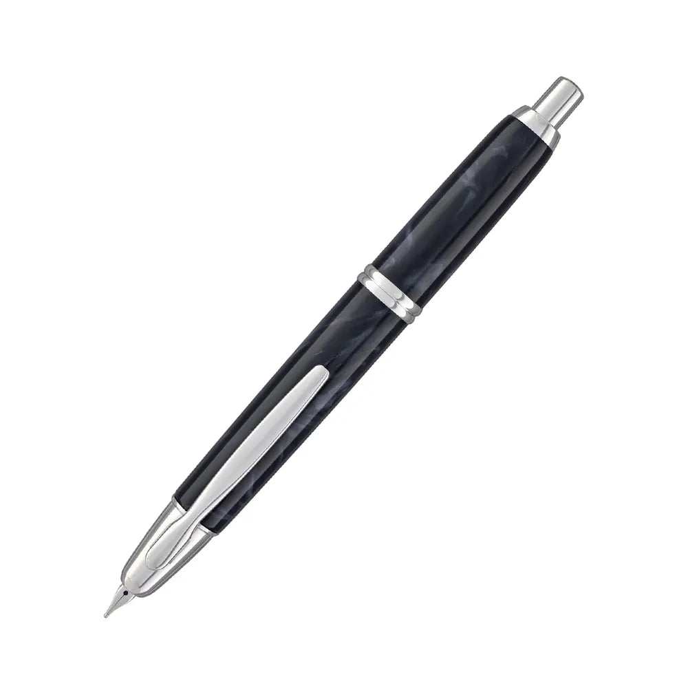 The Pilot Capless Marble Black Fountain Pen stunning and vibrant marble-colored black resin body extends sophistication to your writing style. Every single pen is one-of-a-kind because no two marbling patterns are the same. Designed to delight the fountain pen collector, the pen’s exceptional body is enhanced with lustrous rhodium accents. The Capless fountain pen by Pilot is the world’s first and favorite retractable fountain pen. The Vanishing Point was revolutionary when it was engineered in 1963 and con