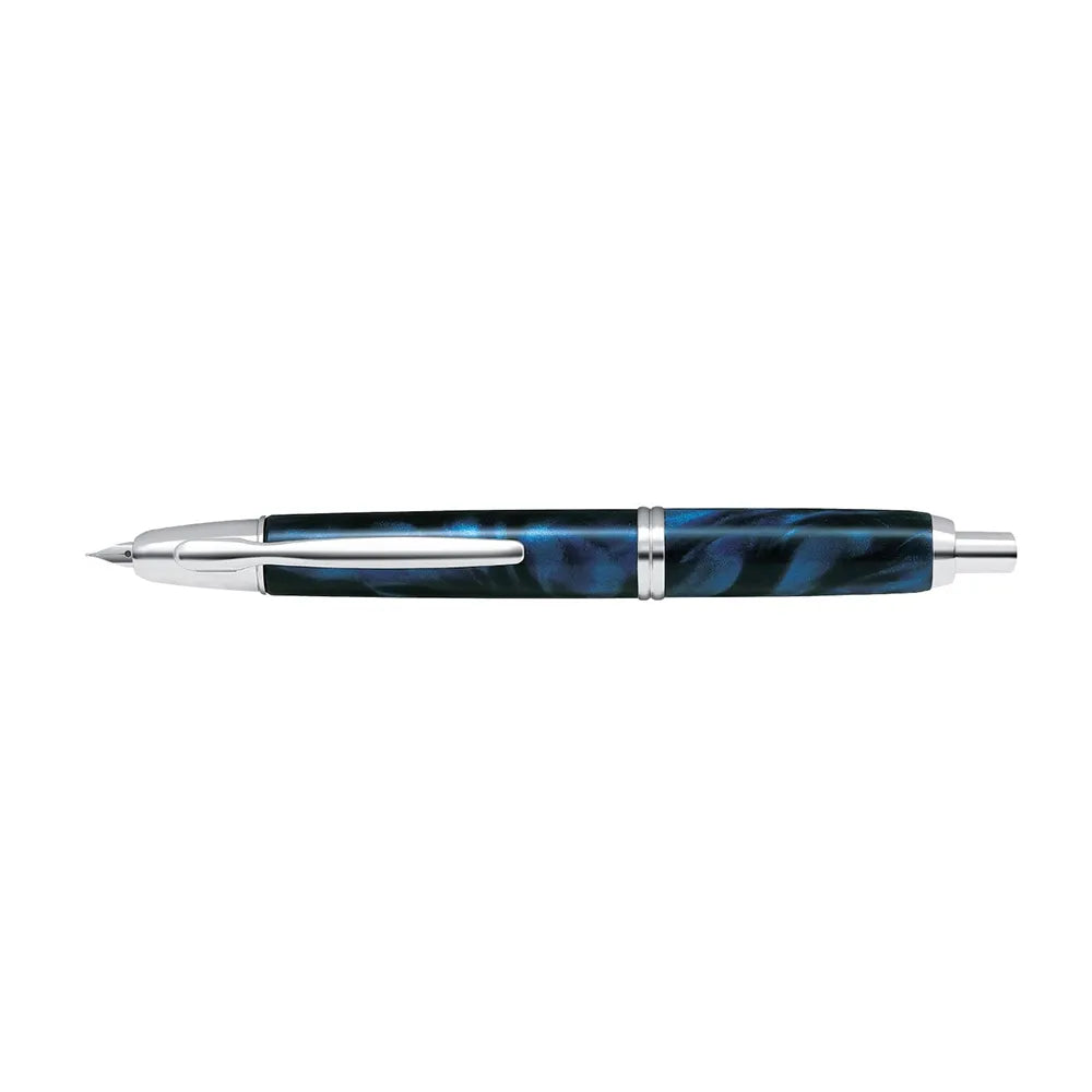 The Pilot Capless Marble Blue Fountain Pen stunning and vibrant marble-colored blue resin body extends sophistication to your writing style. Every single pen is one-of-a-kind because no two marbling patterns are the same. Designed to delight the fountain pen collector, the pen’s exceptional body is enhanced with lustrous rhodium accents. The Capless fountain pen by Pilot is the world’s first and favorite retractable fountain pen. The Vanishing Point was revolutionary when it was engineered in 1963 and conti