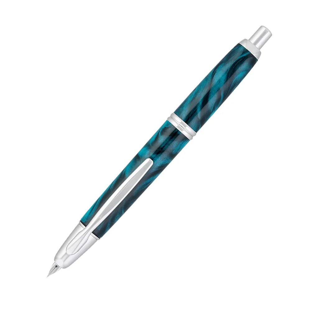 The Pilot Capless Marble Green Fountain Pen stunning and vibrant marble-colored green resin body extends sophistication to your writing style. Every single pen is one-of-a-kind because no two marbling patterns are the same. Designed to delight the fountain pen collector, the pen’s exceptional body is enhanced with lustrous rhodium accents. The Capless fountain pen by Pilot is the world’s first and favorite retractable fountain pen. The Vanishing Point was revolutionary when it was engineered in 1963 and con