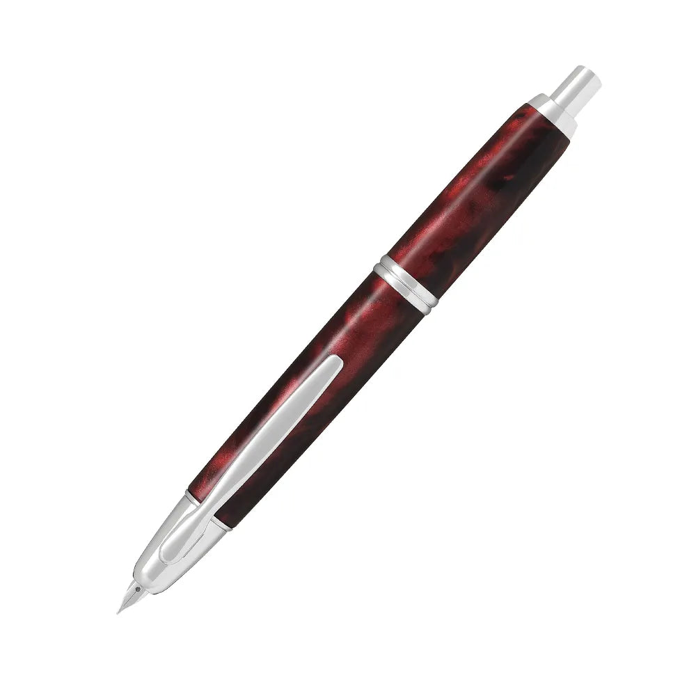 The Pilot Capless Marble Red Fountain Pen stunning and vibrant marble-colored Red resin body extends sophistication to your writing style. Every single pen is one-of-a-kind because no two marbling patterns are the same. Designed to delight the fountain pen collector, the pen’s exceptional body is enhanced with lustrous rhodium accents. The Capless fountain pen by Pilot is the world’s first and favorite retractable fountain pen. The Vanishing Point was revolutionary when it was engineered in 1963 and continu