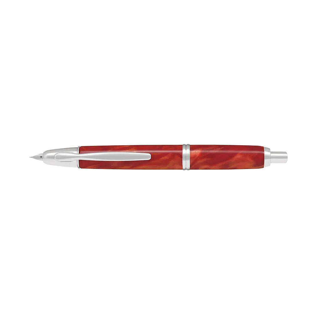 The Pilot Capless Marble Orange Fountain Pen stunning and vibrant marble-colored Orange resin body extends sophistication to your writing style. Every single pen is one-of-a-kind because no two marbling patterns are the same. Designed to delight the fountain pen collector, the pen’s exceptional body is enhanced with lustrous rhodium accents. The Capless fountain pen by Pilot is the world’s first and favorite retractable fountain pen. The Vanishing Point was revolutionary when it was engineered in 1963 and c
