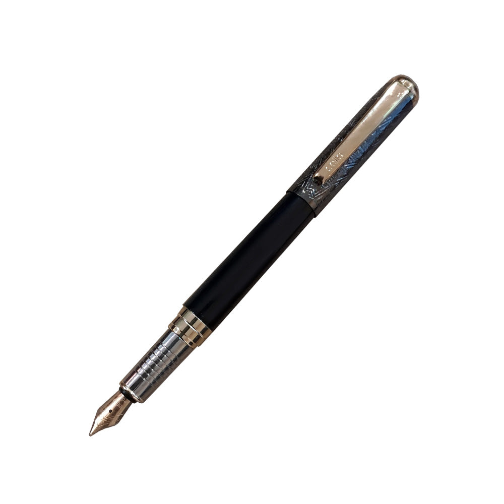 Presenting finely handcrafted textured metal pen with 22K gold plated nib & Cartridge based, ideal for gifting. Premium black & gun metal etched cap with gold-plated trim. Cap on/ cap off mechanism, cartridge based fountain pen. Colours : Black Premium Black and Gun Metal Etched Cap Gold-Plated Trims Pen Opening Mechanism: Cap on/ cap off Body & Design Finish: Glossy Finish Refillable 22K Gold Plated Steel Nib cartridge based fountain pen It has Iridium Tip that ensure smooth writing