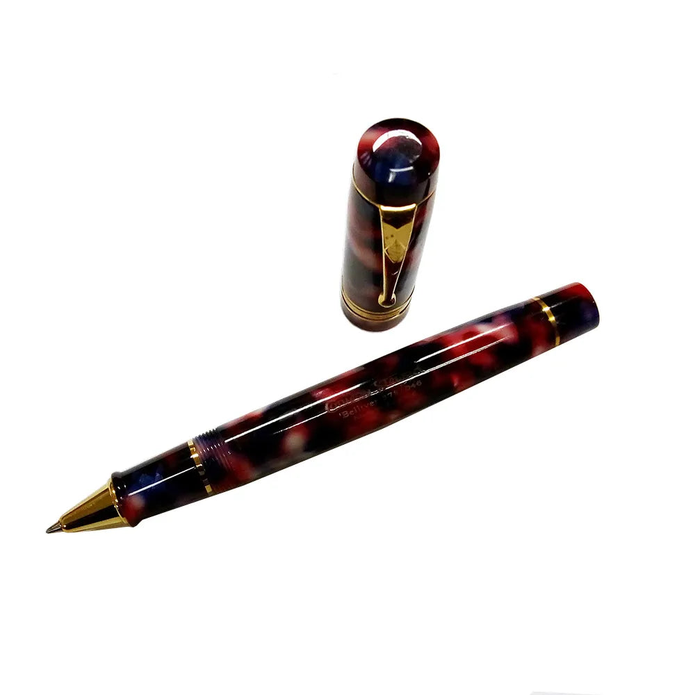 The Conway Stewart Belliver is sized to be ideal for the widest possible range of hand sizes and writing styles. Not so large as to be unwieldy in the hand, but still of a size to command instant attention, as well as to afford a comfortable grip. The Conway Stewart Belliver Nebula Rollerball is carefully crafted in gold ring & clip, following the shape and size of Conway Stewart’s popular Belliver series. Red, Pink & Black Colour Nebula Resin Gold ring & clip Screw Off Cap Designed and manufactured in U.K.