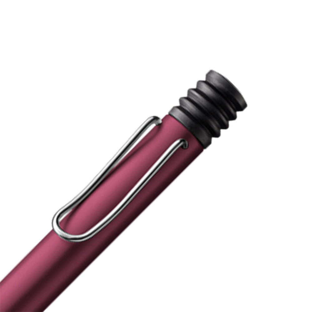 The Lamy AL-Star Ballpoint Pen is the attractive, young writing instrument which satisfies even the highest requirements. Made of feather-light robust aluminium, anodised in various colours. With ergonomic transparent grip and spring-action metal clip. Ballpoint pen comes with LAMY large capacity refill M 16 black. Aluminium, dark purple metallic anodized / metal clip / ergonomic plastic grip / with giant refill LAMY M16 M black Part No. 4000920